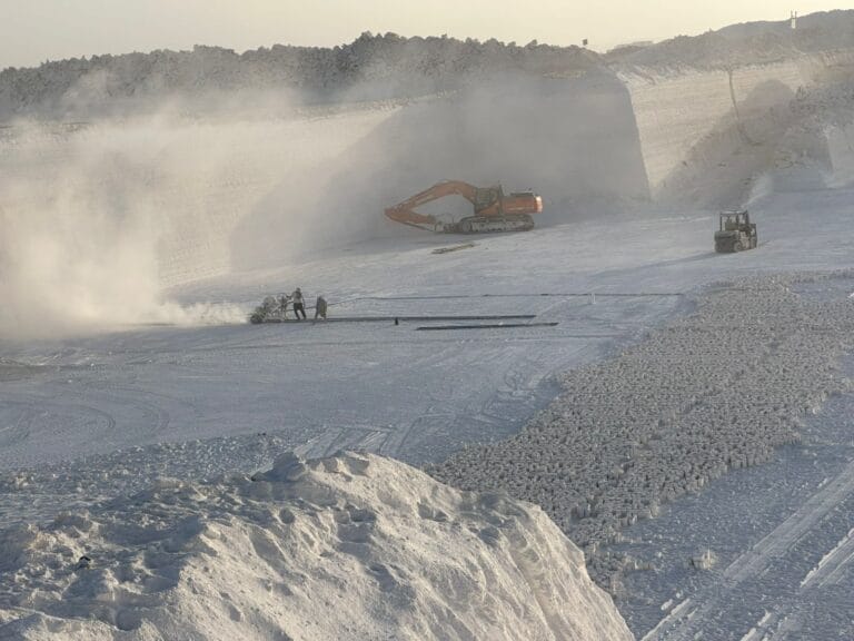 Talc Powder and Feldspar Company - Talc powder quarry with heavy machinery and workers, showing the scale of talc mining.